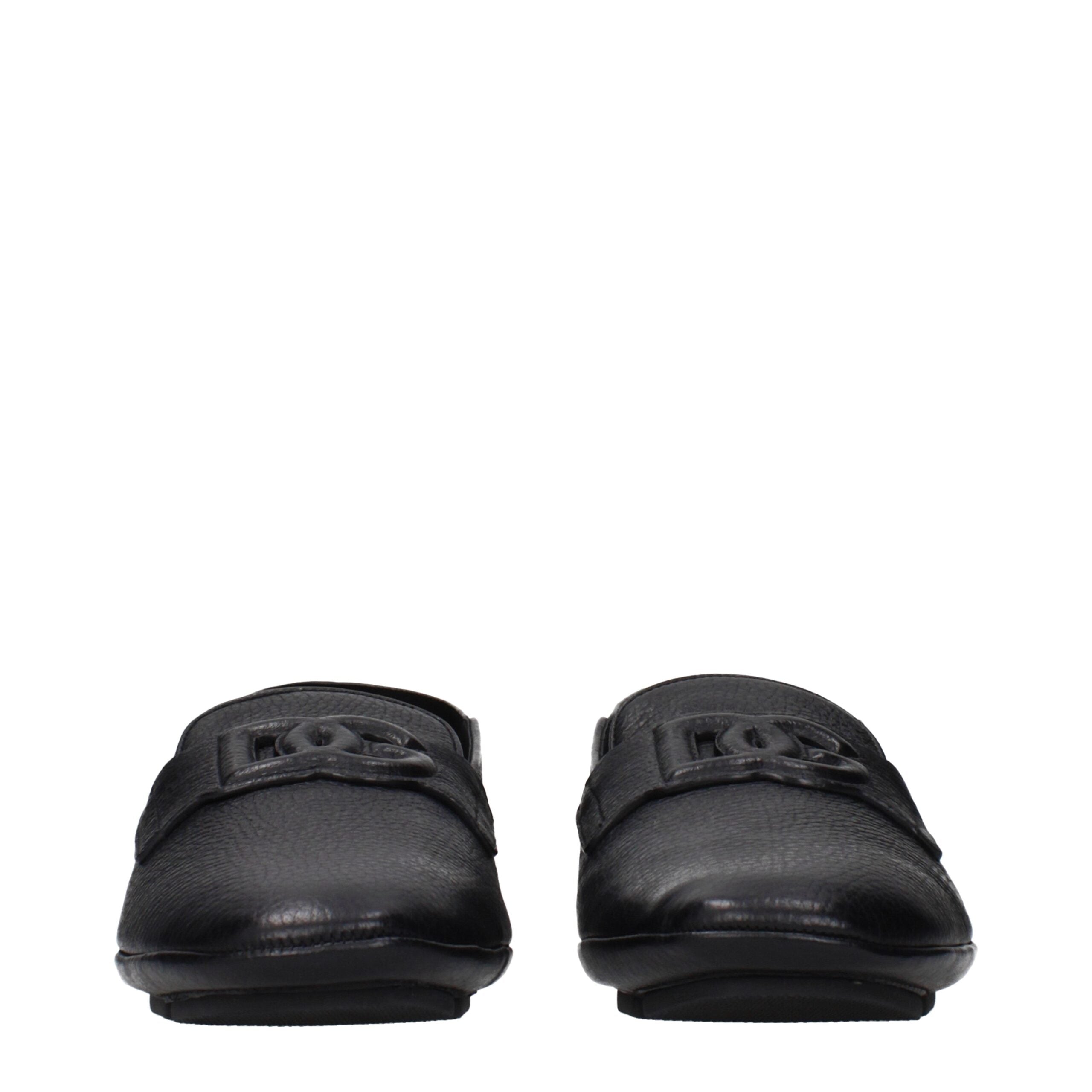 Chaussures mocassins en cuir noir Dolce & Gabbana pour homme, style slip-on avec semelle élégante et finition raffinée.