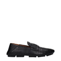 Chaussures mocassins en cuir noir Dolce & Gabbana pour hommes, style slip-on, élégantes et confortables.