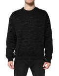 Sweat-shirt à col rond noir Dolce & Gabbana avec monogramme, en coton, porté sur mannequin.