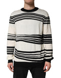 Pull à col rond Dolce & Gabbana en maille noire et blanche à rayures, style décontracté et élégant.