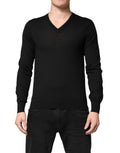 Pull noir en cachemire Dolce & Gabbana avec col en V, vue de face, détails du tissu doux et élégant.