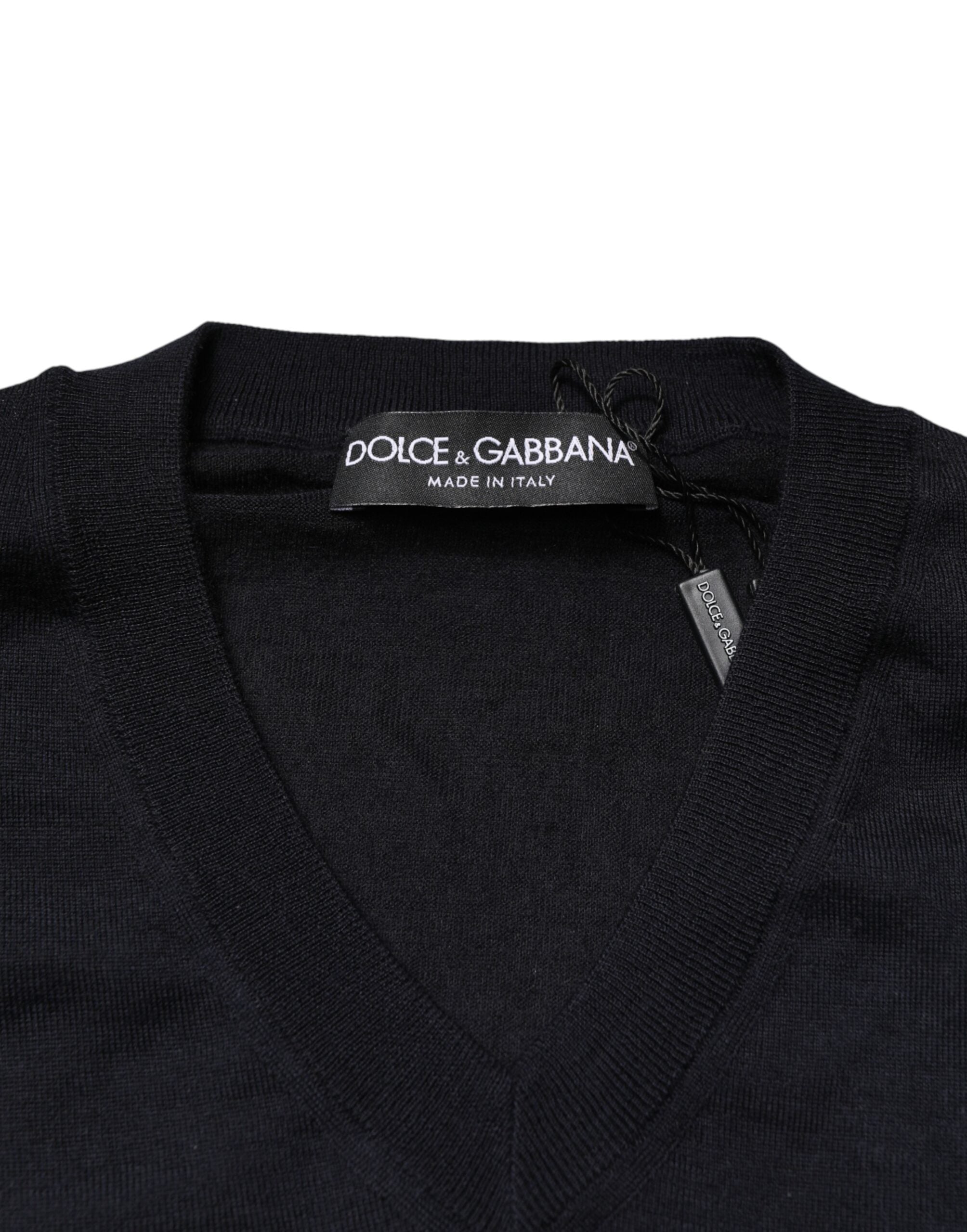 Pull en cachemire noir Dolce & Gabbana à col en V pour homme, doux et élégant, visible en gros plan.