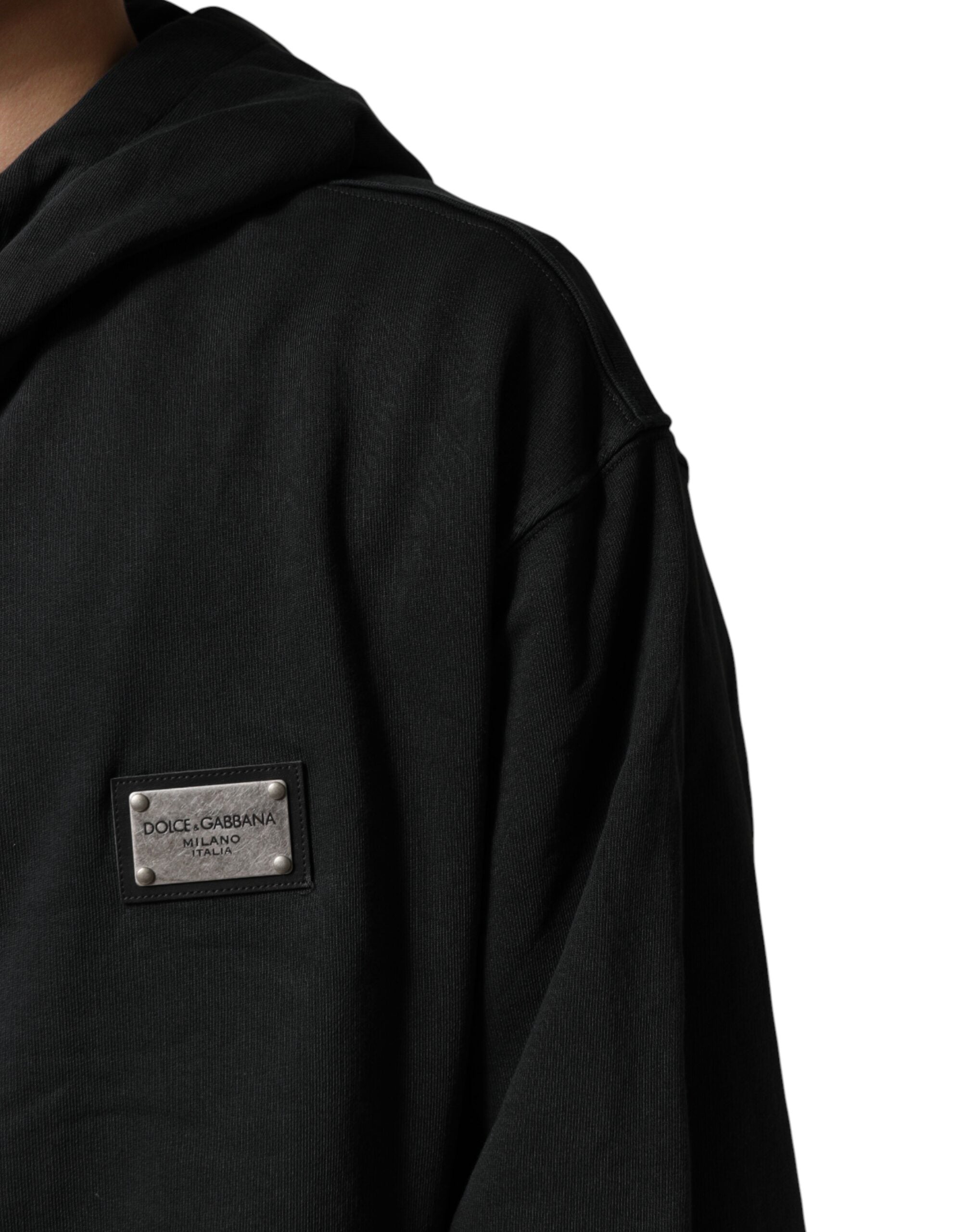 Sweat à capuche zippé noir Dolce & Gabbana avec logo, tissu confortable et design élégant visible sur l'image.
