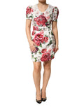 Robe courte blanche Dolce & Gabbana à fleurs ornementées et coupe près du corps, élégante et féminine.