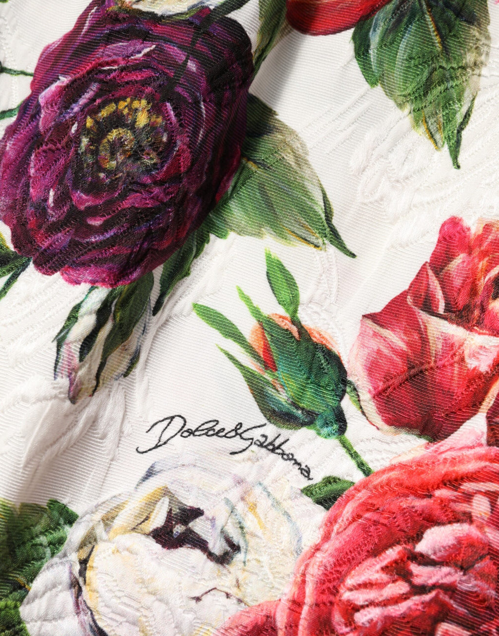 Robe courte blanche Dolce & Gabbana à fleurs ornées, coupe ajustée, style élégant et féminin.