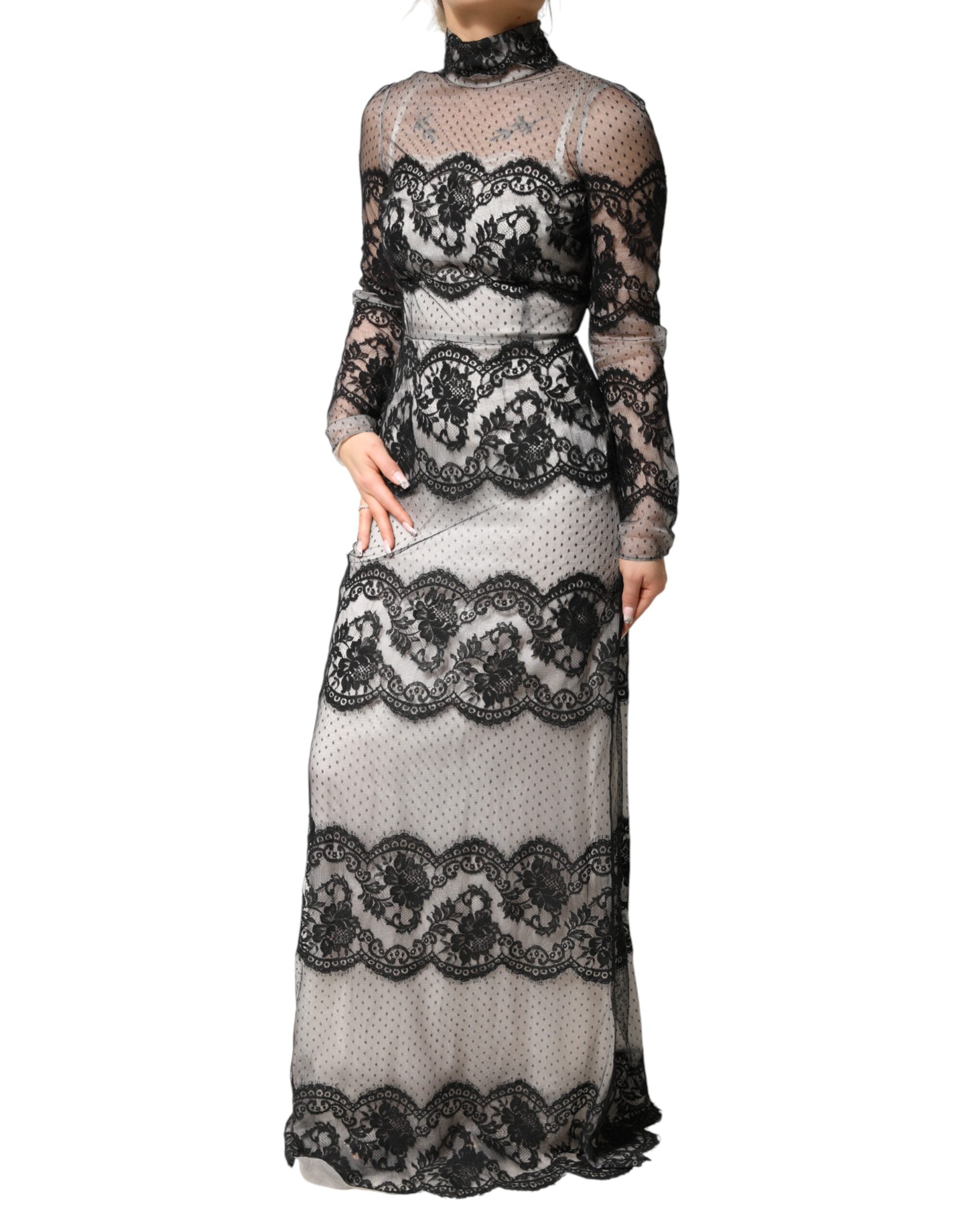 Robe longue Dolce & Gabbana en dentelle noire et blanche, en soie mélangée, coupe ajustée, élégante et sophistiquée.