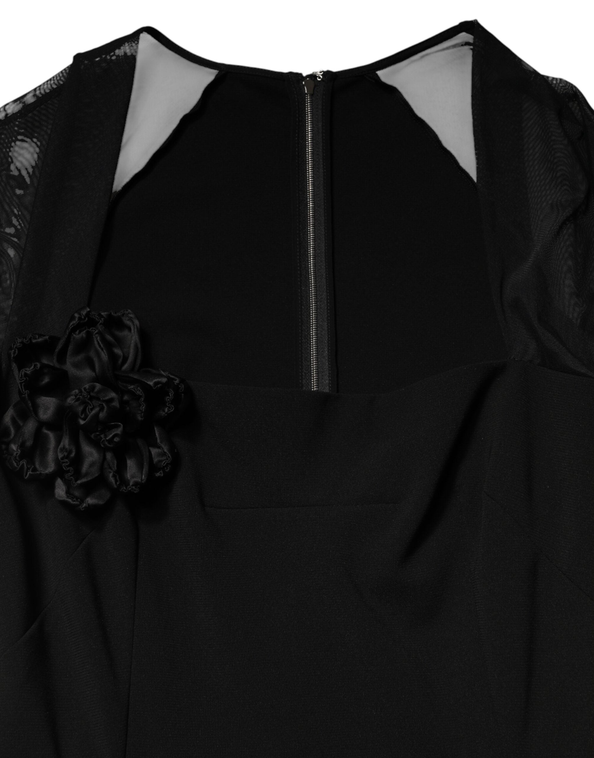 Robe midi noire en tulle transparente Dolce & Gabbana avec yoke en rosettes et coupe ajustée, élégante et sophistiquée.