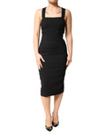 Robe midi noire sans manches Dolce & Gabbana avec encolure carrée, vue de face sur un fond neutre.