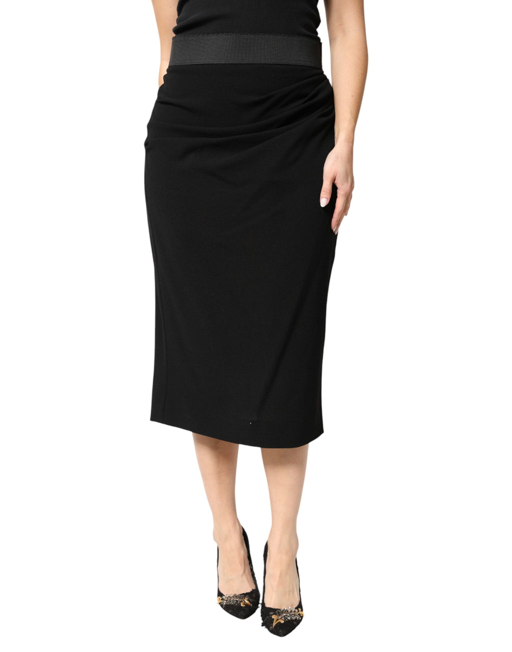 Jupe midi noire en laine à taille haute de Dolce & Gabbana, coupe pencil élégante, portée sur mannequin.