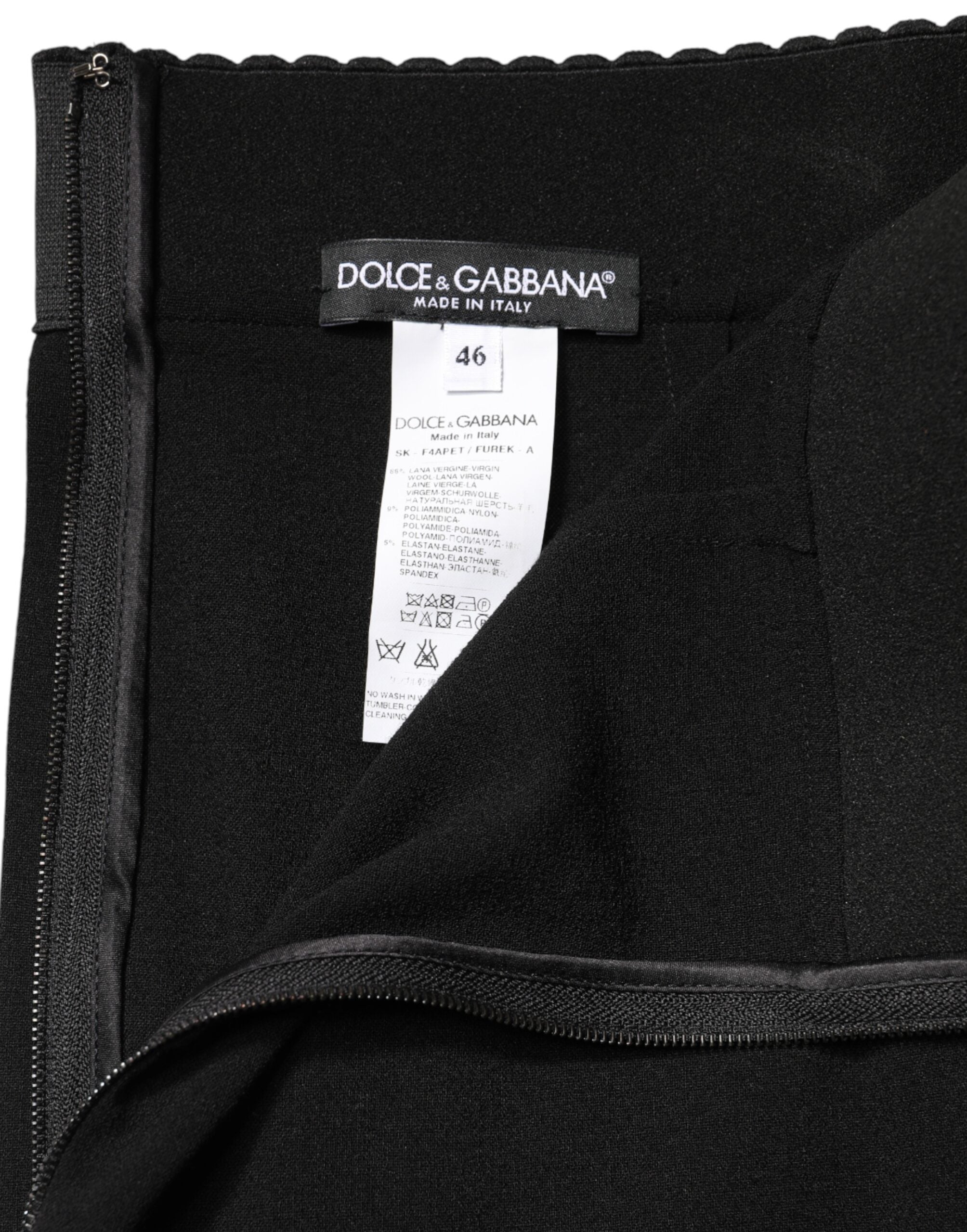 Jupe crayon midi en laine noire de haute taille de Dolce & Gabbana, élégante et ajustée, visible en détail sur l'image.