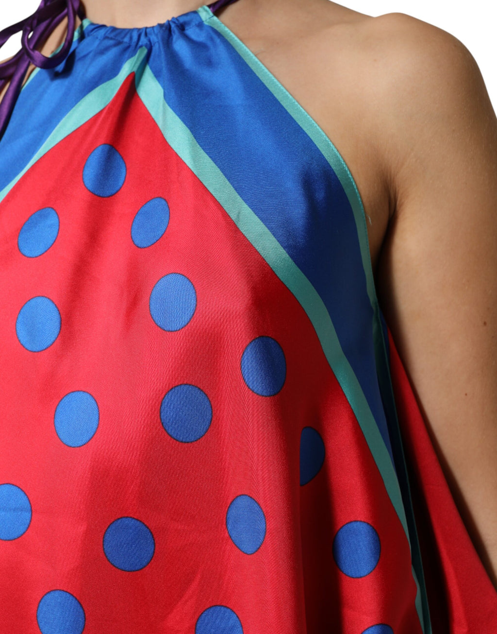 Blouse à pois multicolores Dolce & Gabbana, top à col halter, détail floral et élégant, en tissu léger.