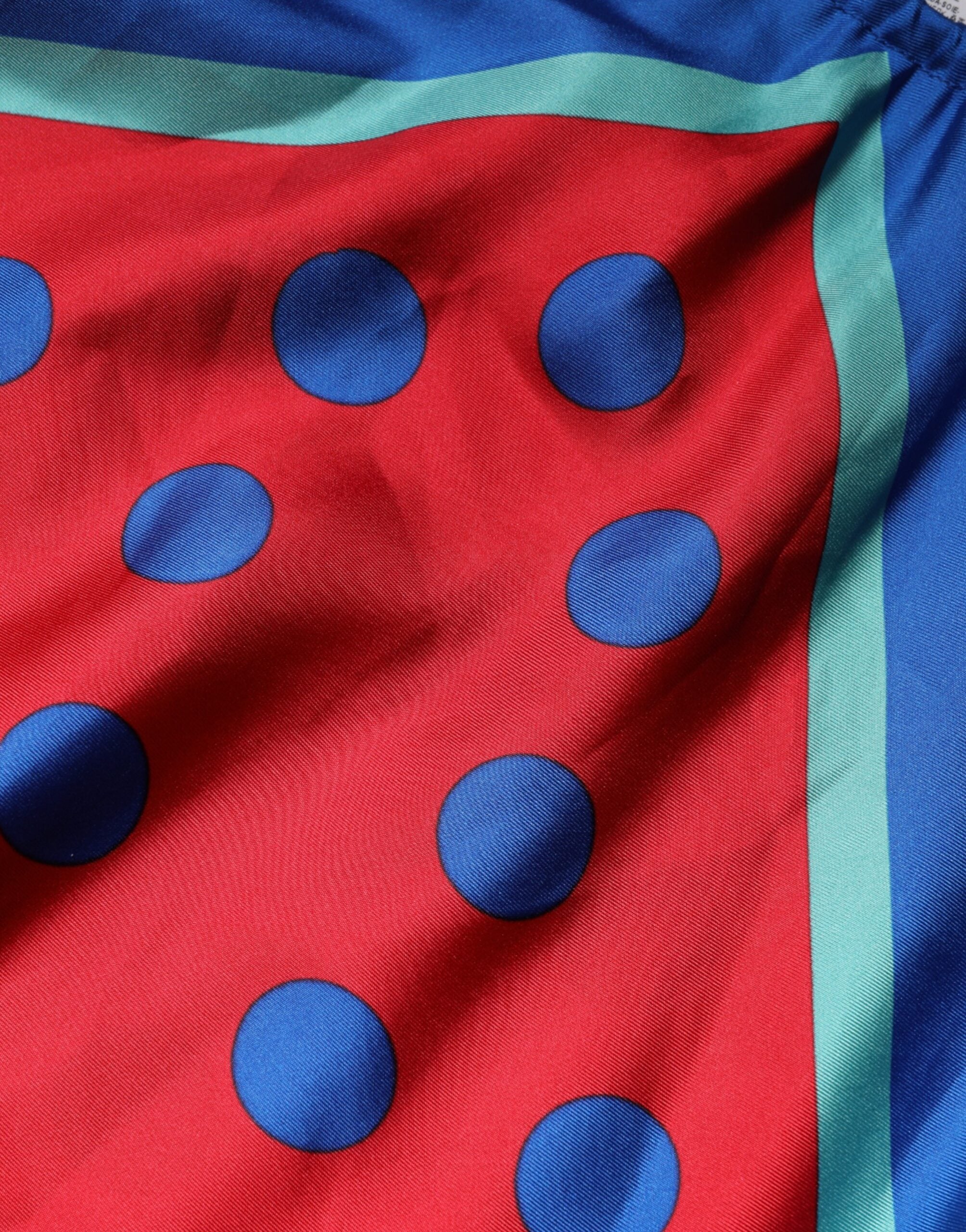 Blouse à pois multicolores Dolce & Gabbana, en tissu léger, avec col halter et design élégant.