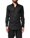 Chemise homme Dolce & Gabbana noire en coton avec détails dorés, style formel et élégant.