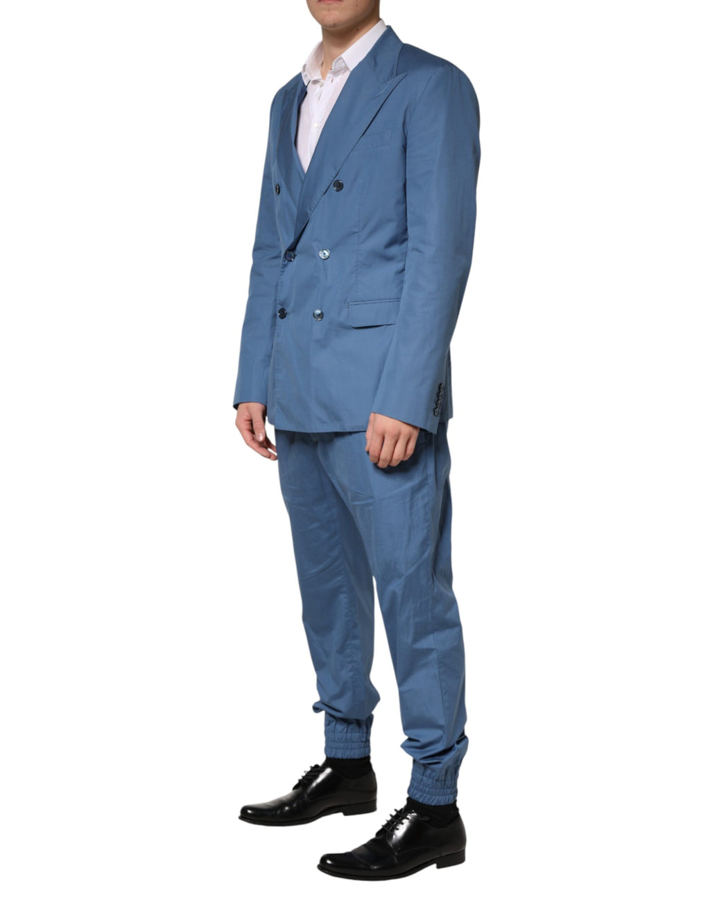 Costume deux pièces en coton bleu Dolce & Gabbana, veste croisée à double boutonnage et pantalon assorti.