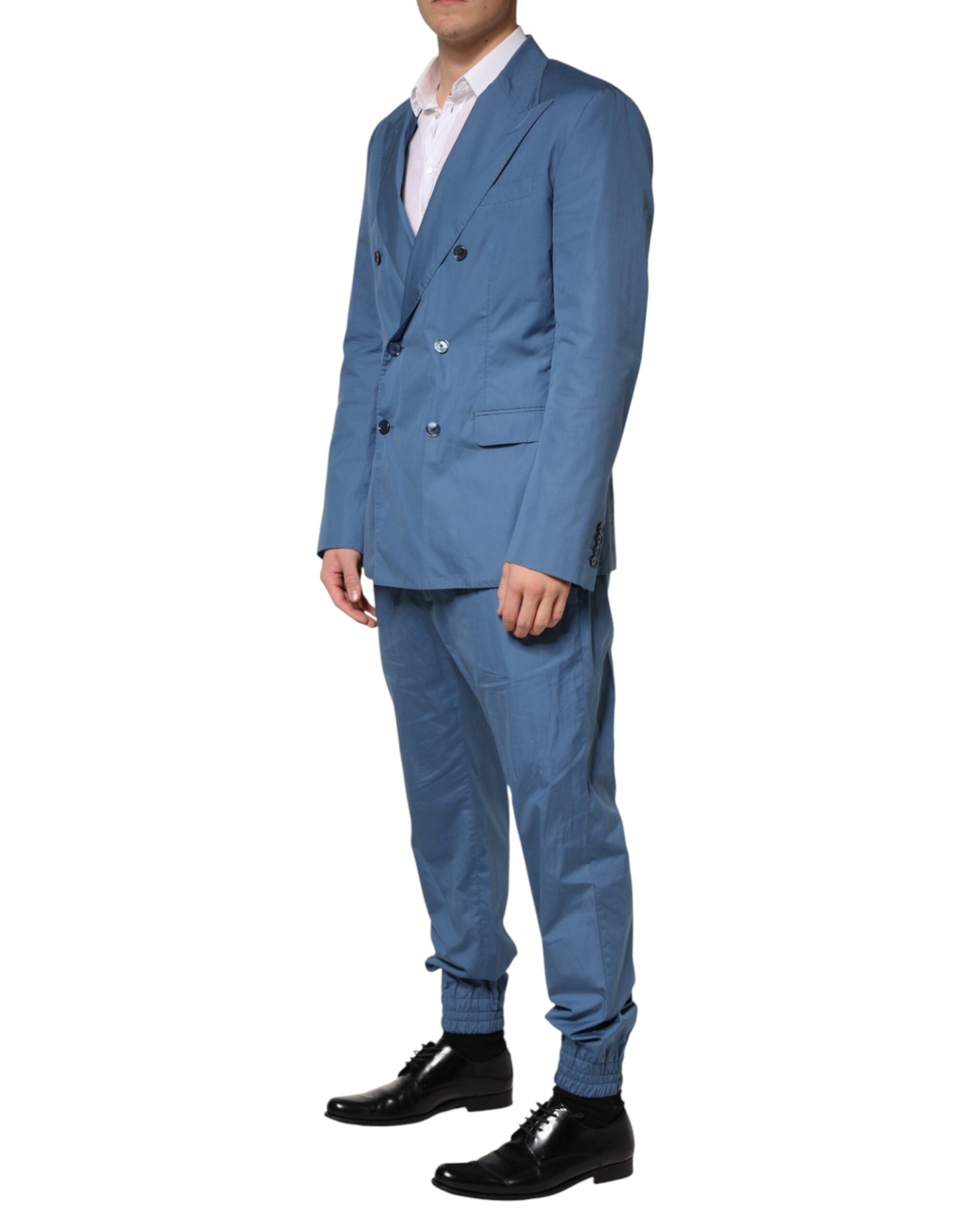 Costume deux pièces en coton bleu Dolce & Gabbana, veste croisée à double boutonnage et pantalon assorti.