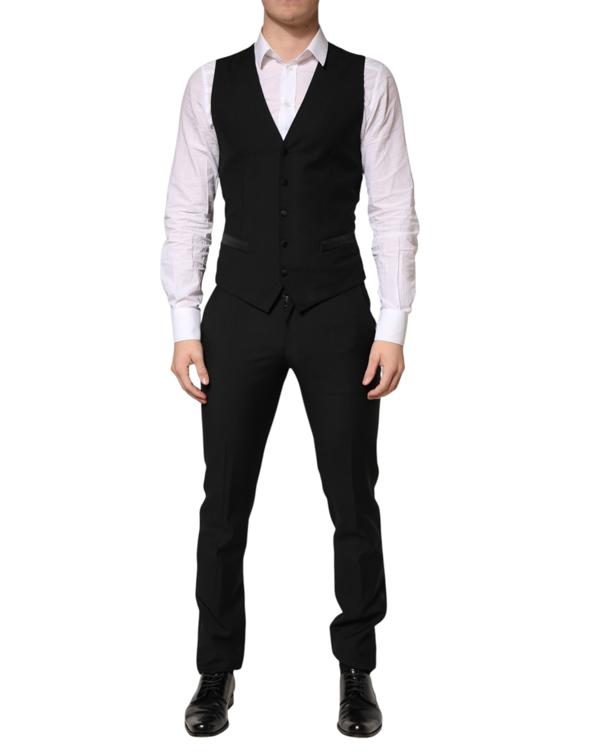 Costume homme noir en laine Dolce & Gabbana à trois pièces, veste à simple boutonnage et pantalon élégant.