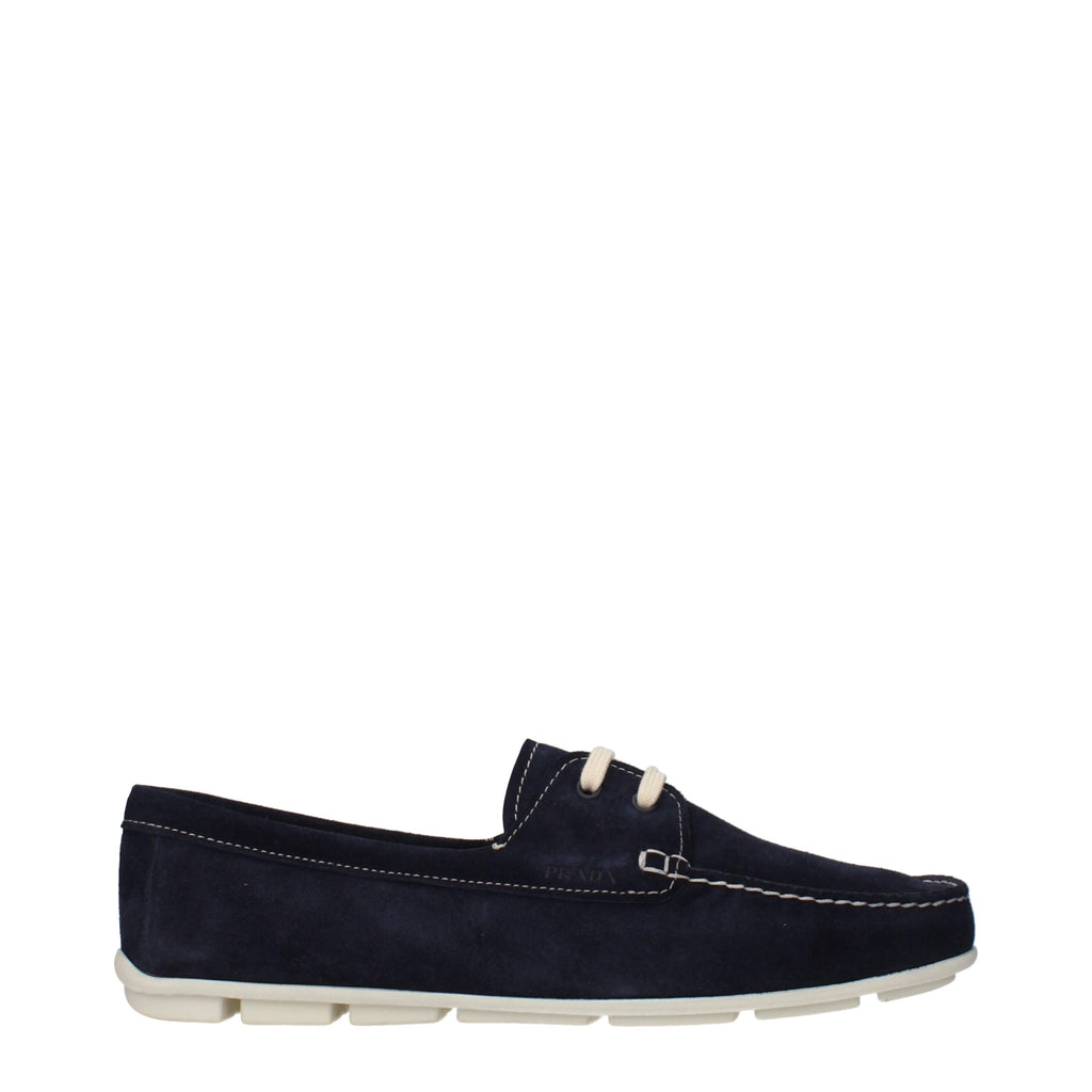 Mocassins en cuir bleu Prada pour homme, style slip-on, avec semelle en cuir et design élégant.