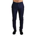 Pantalons en laine vierge bleue Dolce & Gabbana, coupe élégante et moderne, visibles en gros plan sur l'image.