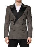 Veste blazer grise à double boutonnage Dolce & Gabbana, coupe élégante, détails sophistiqués, tissu de qualité.