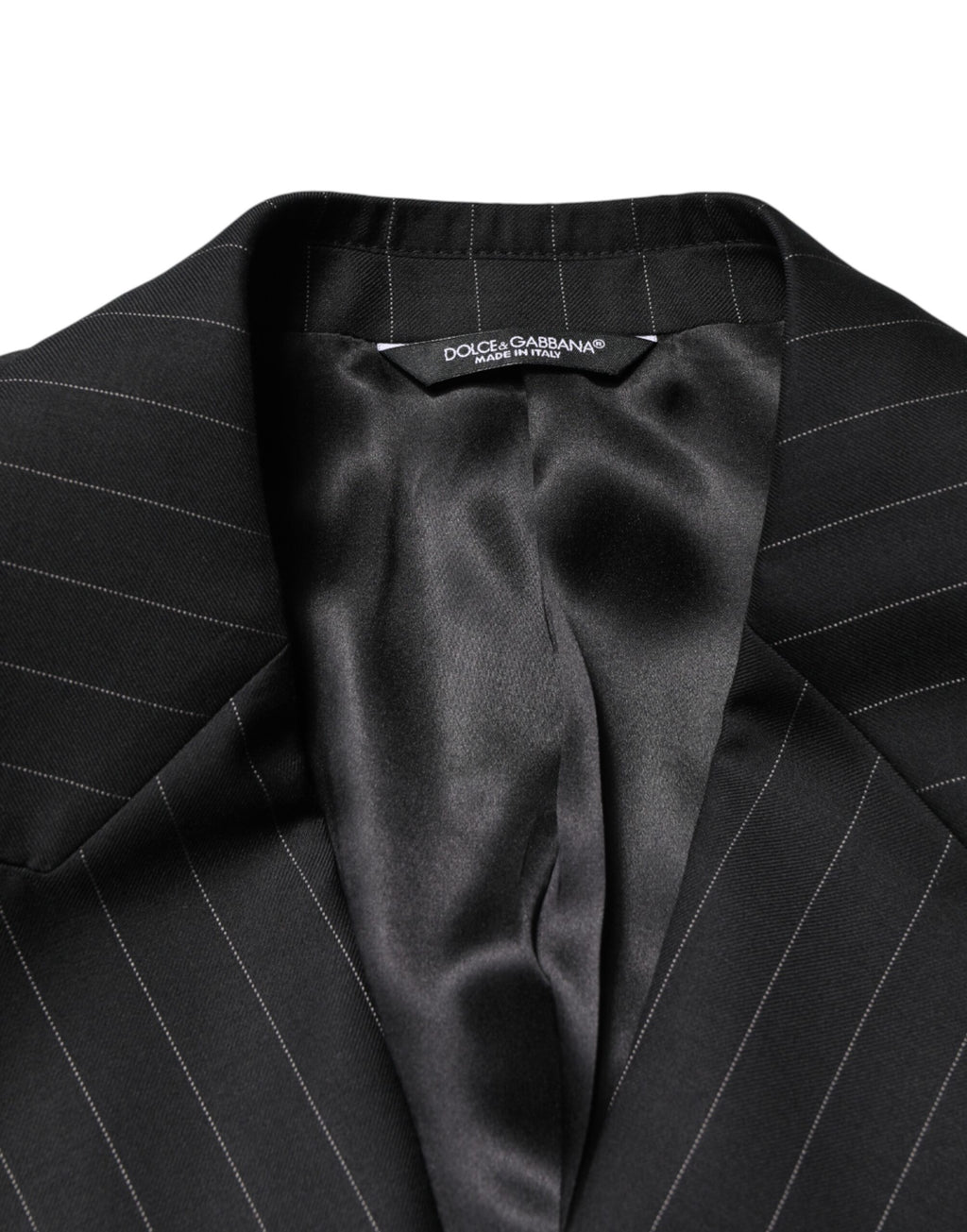 Blazer noir à rayures Dolce & Gabbana, double boutonnage et coupe élégante, porté sur un mannequin.