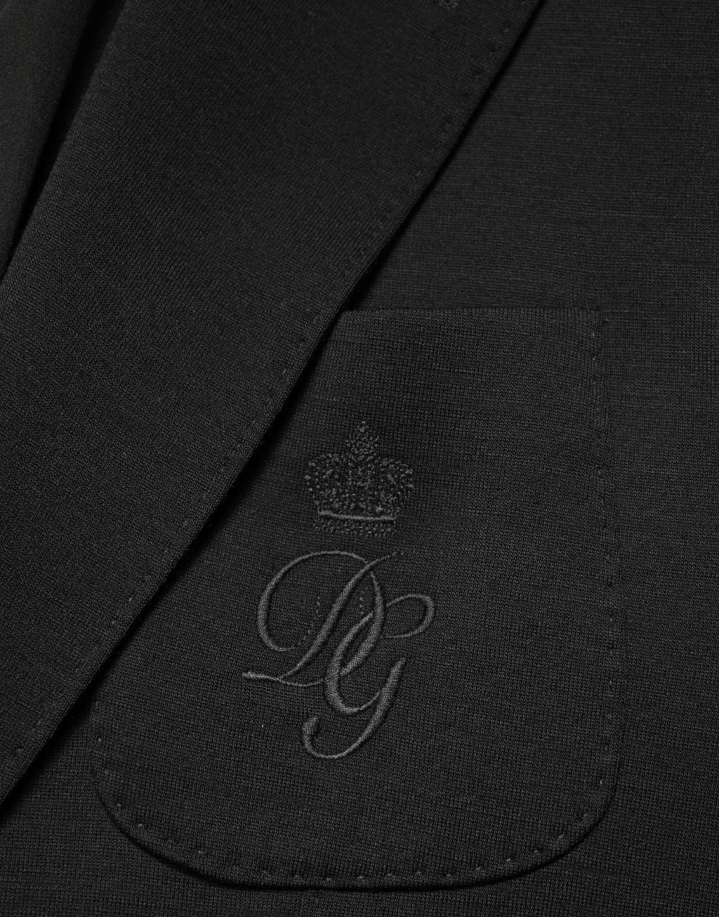 Blazer en laine noire Dolce & Gabbana, coupe simple à deux boutons, veste élégante pour homme.