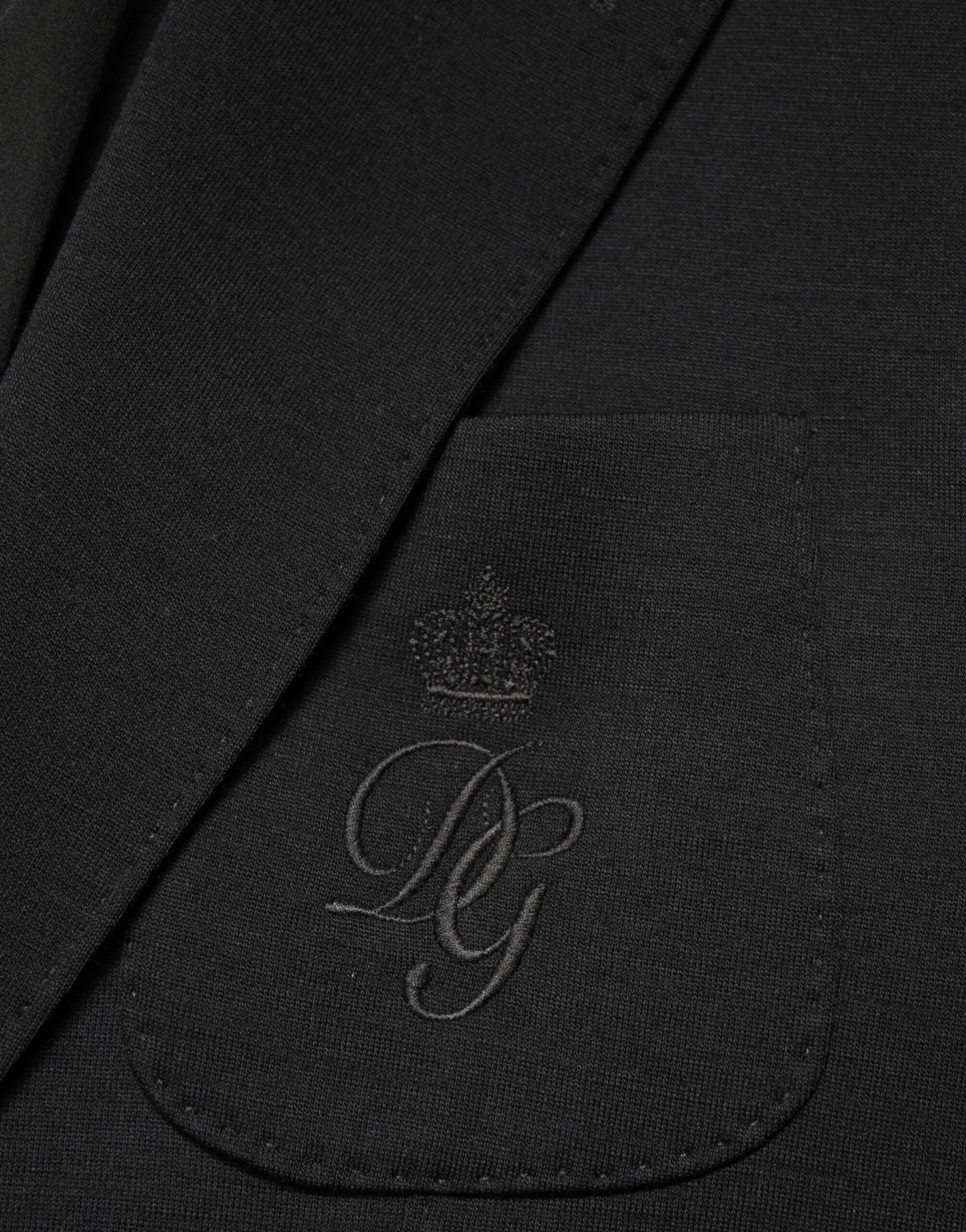 Blazer en laine noire Dolce & Gabbana, coupe simple à deux boutons, veste élégante pour homme.