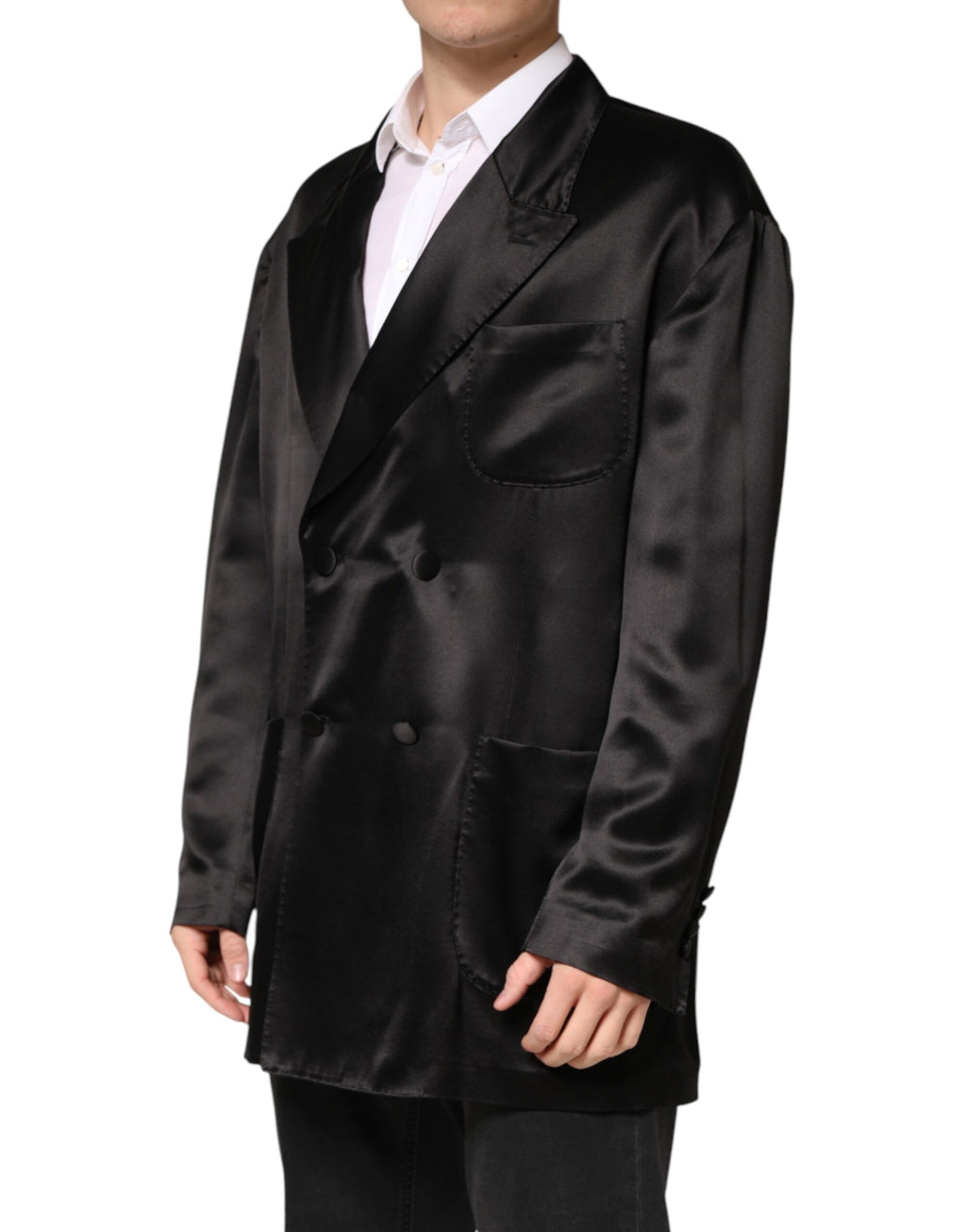 Blazer en soie noire Dolce & Gabbana à double boutonnage, style élégant avec col cranté et boutons dorés.