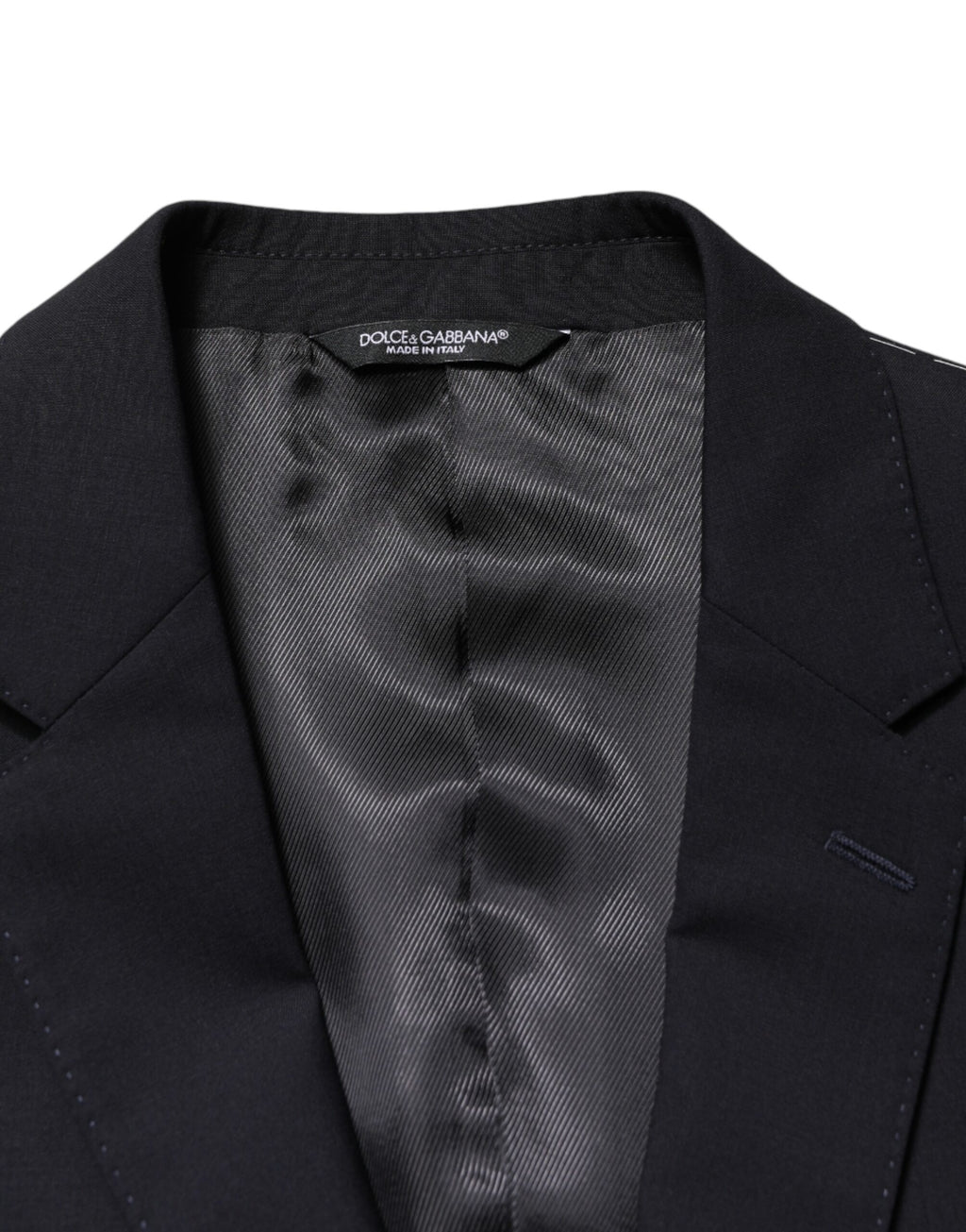 Blazer noir en laine à deux boutons de Dolce & Gabbana, coupe classique et élégante, vue de face sur mannequin.