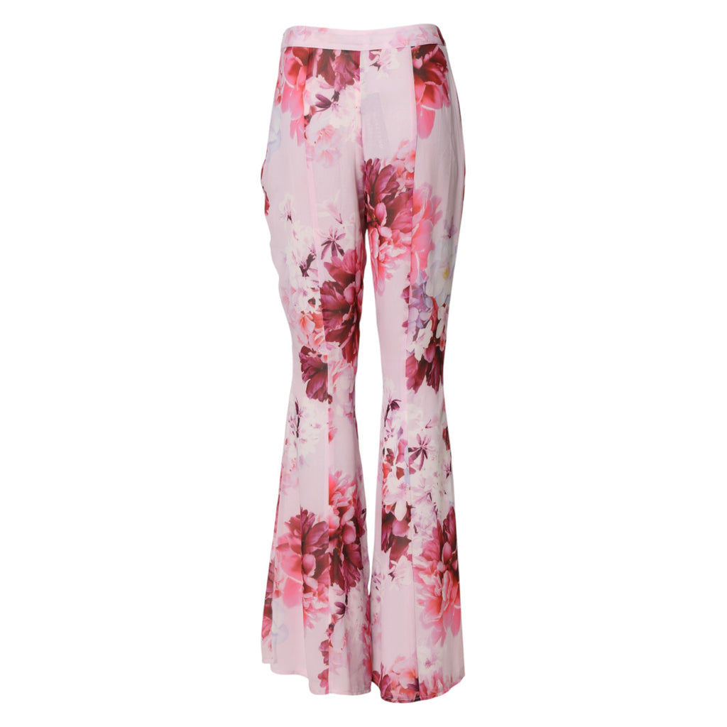 Pantalon flare rose à taille haute Guess by Marciano avec motif floral, style élégant et tendance pour femmes.