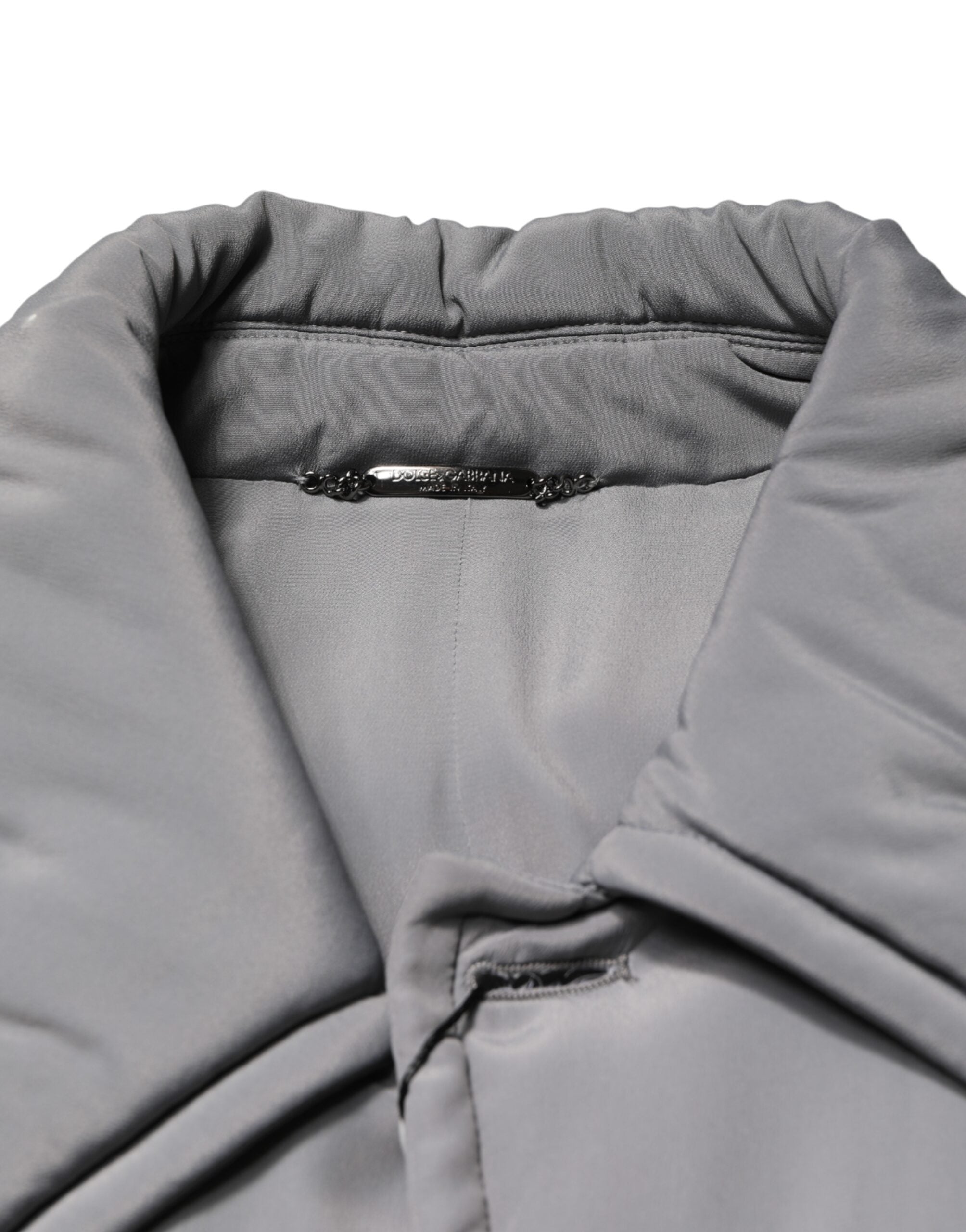 Veste Dolce & Gabbana en acétate gris à col rembourré, coupe élégante et moderne, vue de face sur fond neutre.