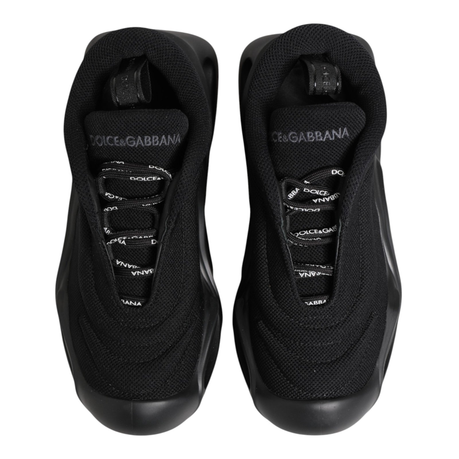 Baskets basses Dolce & Gabbana Noires Slip On à motif vague, confortables et modernes, en cuir avec semelle blanche.