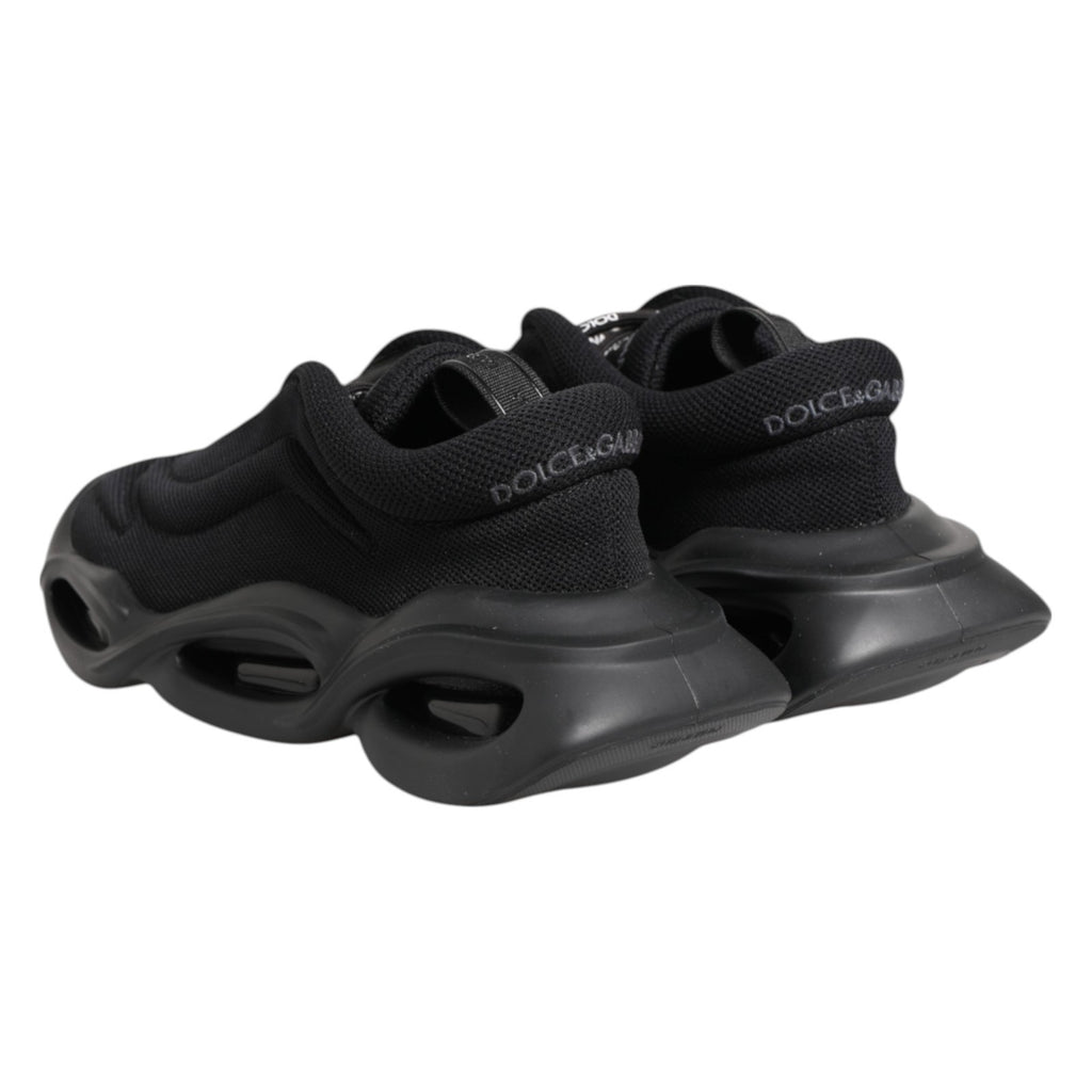 Chaussures Dolce & Gabbana sneakers basses noires Slip On avec motif vague, vue de côté.