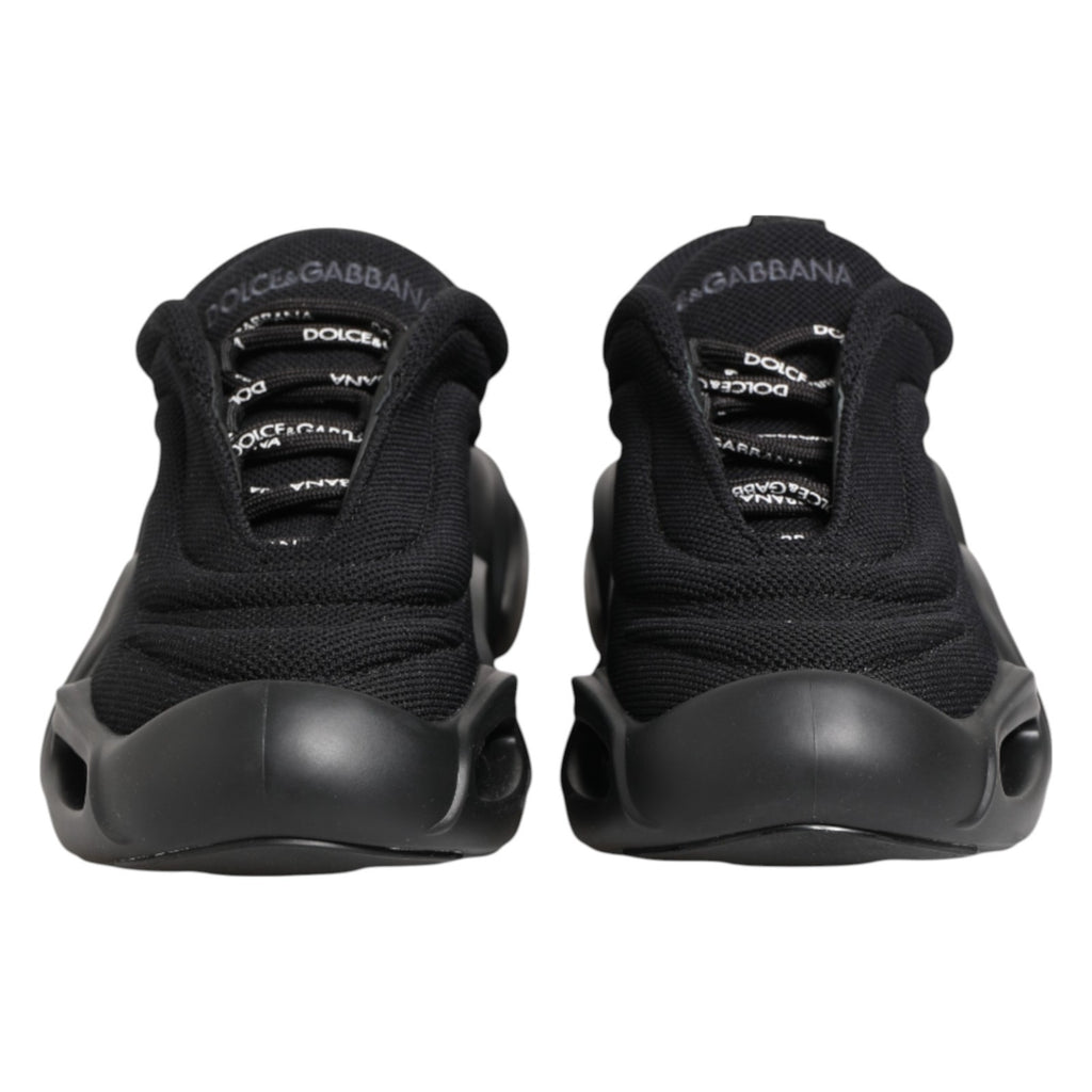 Chaussures sneakers basses noires Dolce & Gabbana Slip On avec motif en vague et design élégant.