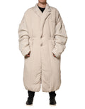 Manteau long beige Dolce & Gabbana avec col rembourré, veste trench élégante, coupe moderne et détails sophistiqués.