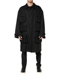 Manteau trench noir Dolce & Gabbana avec poches, col classique, coupe élégante, en tissu léger.