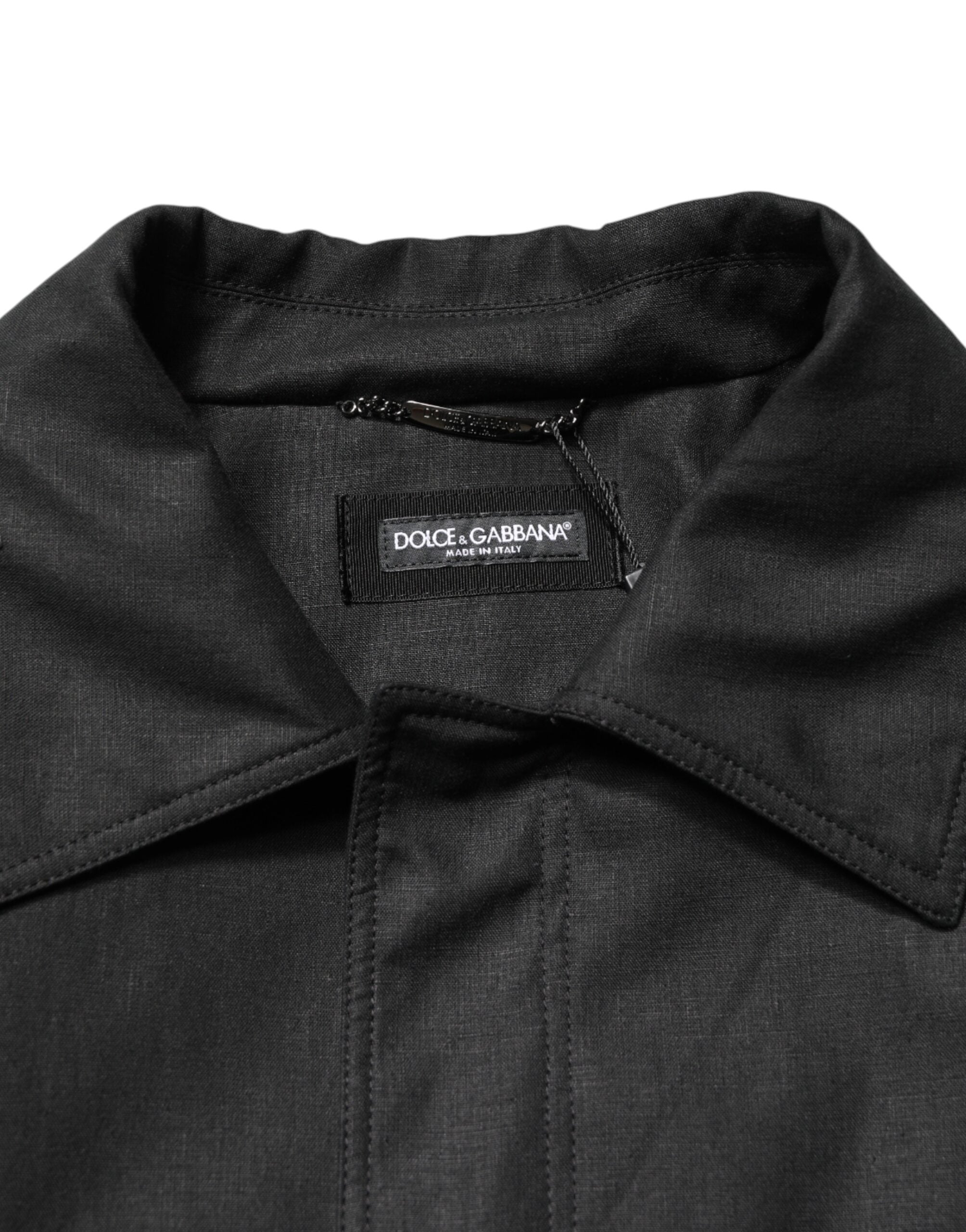 Manteau trench noir avec poches, col rabattu, de la marque Dolce & Gabbana, vue de face.