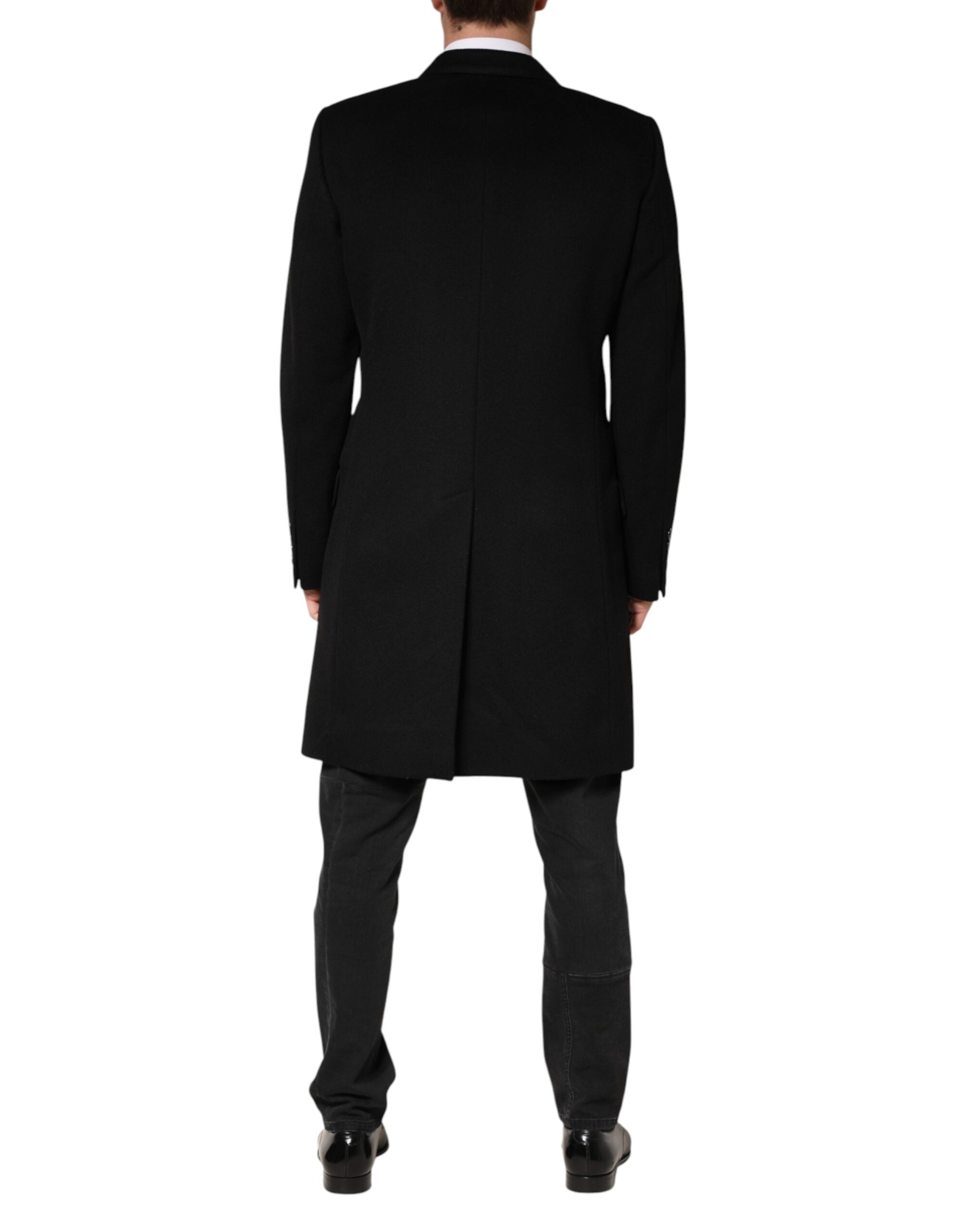 Manteau trench double boutonnage en laine noire Dolce & Gabbana, coupe élégante et classique, porté sur un mannequin.