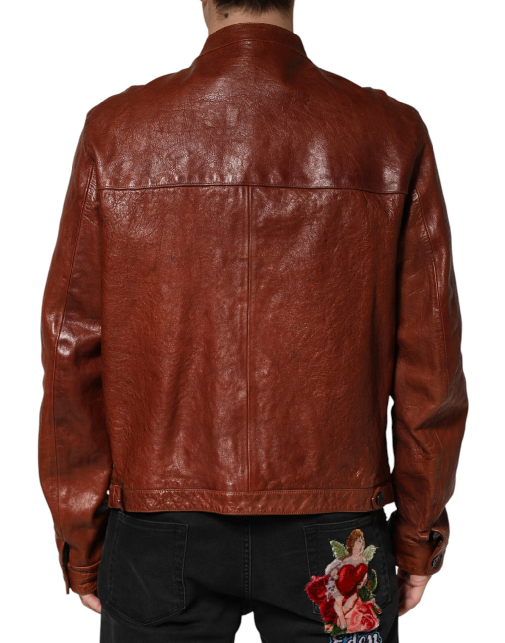 Veste en cuir marron pour homme de style biker avec boutons, Dolce & Gabbana, visible sur l'image.