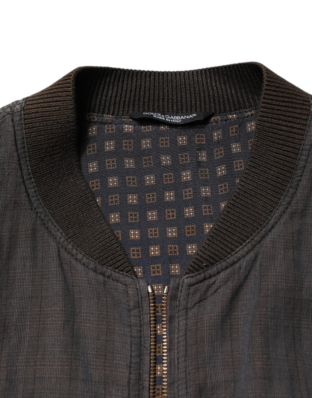 Veste bomber en coton noire à rayures Dolce & Gabbana avec fermeture éclair complète, style élégant et décontracté.
