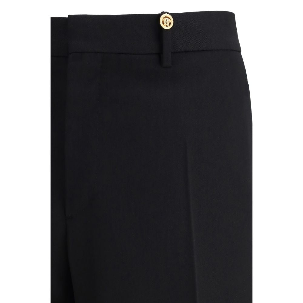 Pantalon de costume Versace en laine noire Oves Aries pour femme, coupe élégante et sophistiquée.