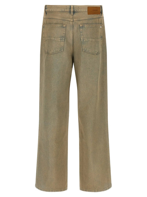 Jean amiri beige en coton coupe droite avec jambes larges et délavage subtil pour un style décontracté