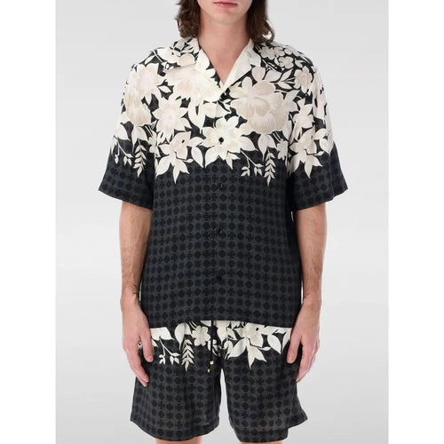 Chemise amiri noire en soie à manches courtes avec motifs floraux en noir et blanc et design géométrique en bas