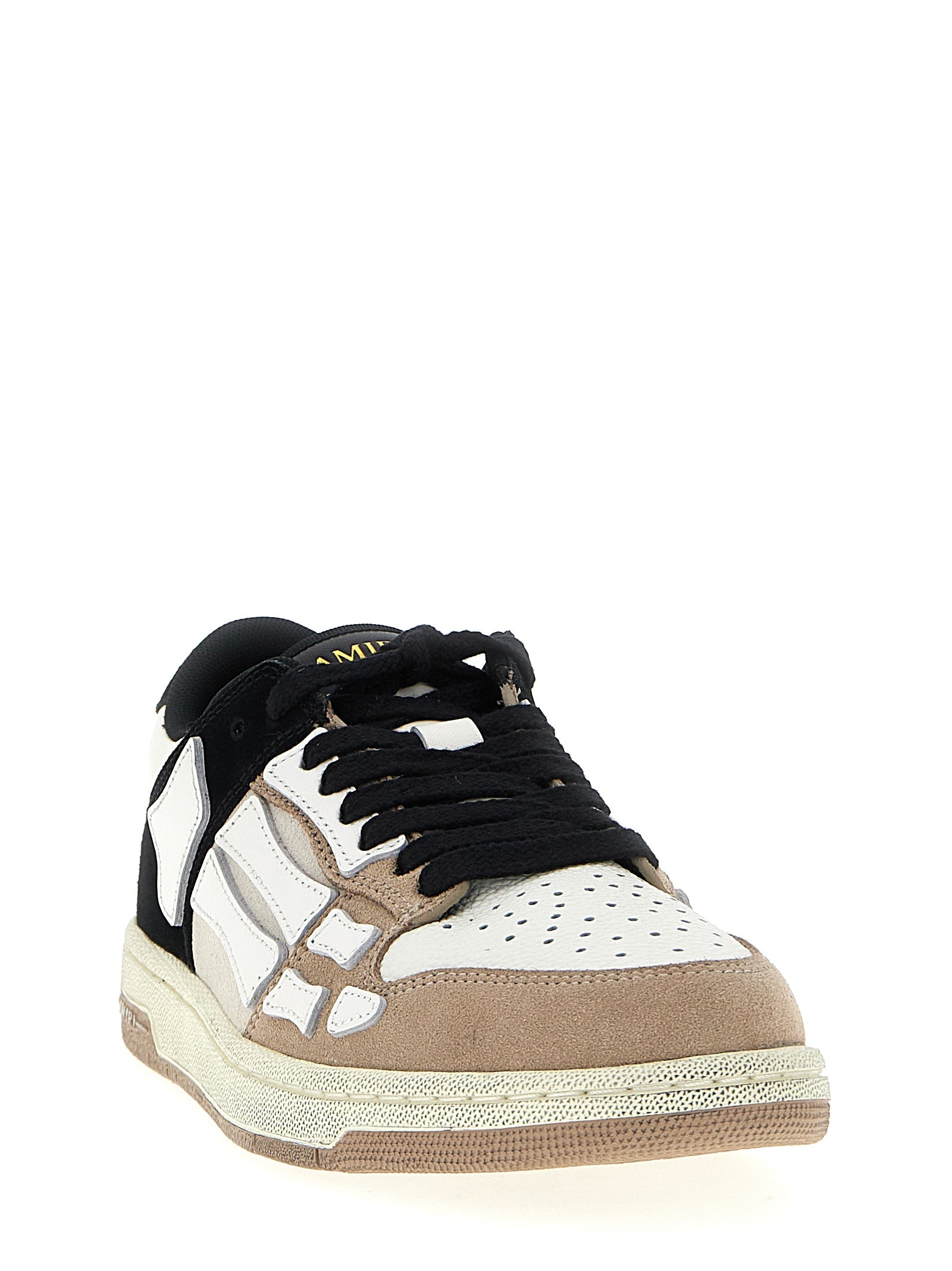 Baskets basses Amiri en cuir de vache multicolore avec design coloré, visibles de côté, pour un style décontracté et tendance.