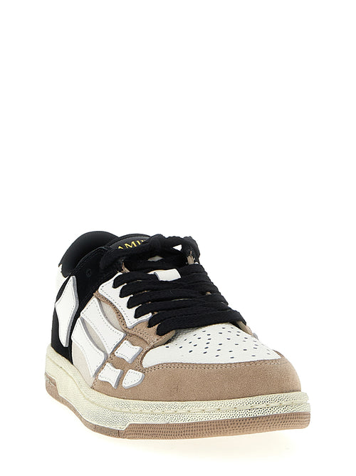 Baskets basses Amiri en cuir de vache multicolore avec design coloré, visibles de côté, pour un style décontracté et tendance.