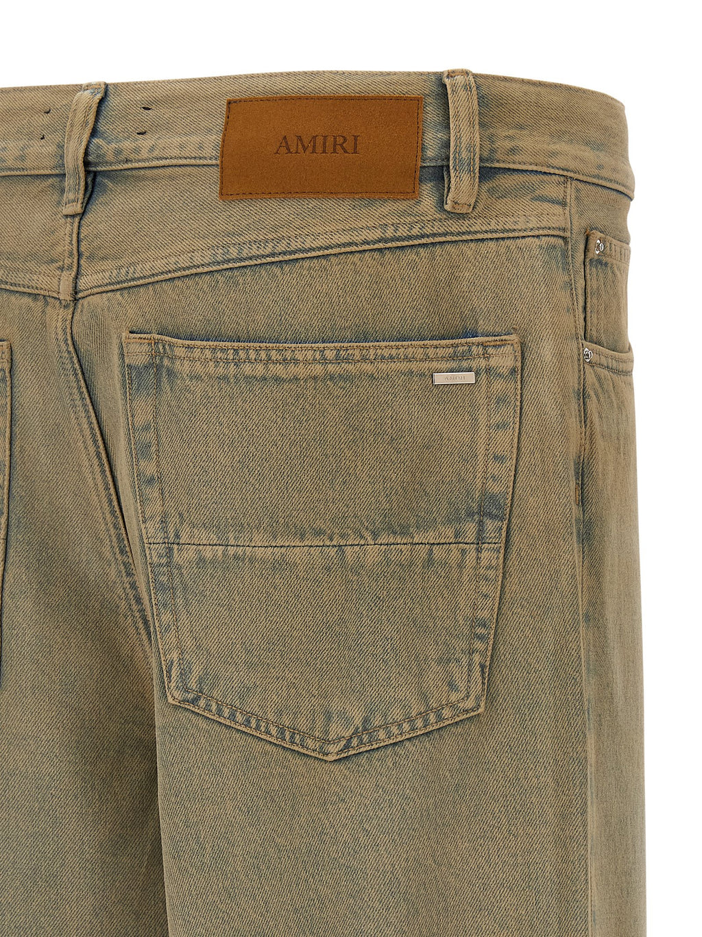 Jeans droit en coton beige de la marque Amiri, coupe droite et style décontracté, avec détails visibles sur le tissu.