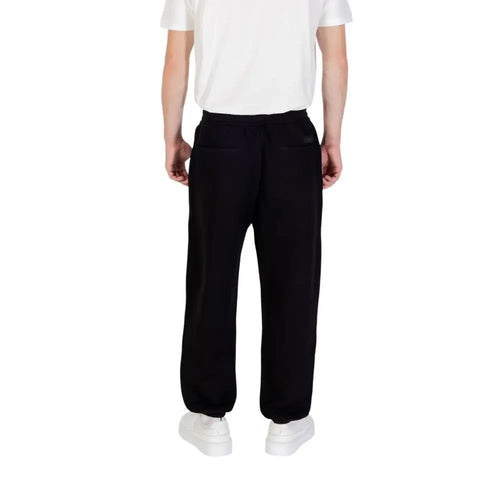 Pantalon de jogging noir armani exchange en coton avec coupe décontractée et poignets élastiques pour le sport