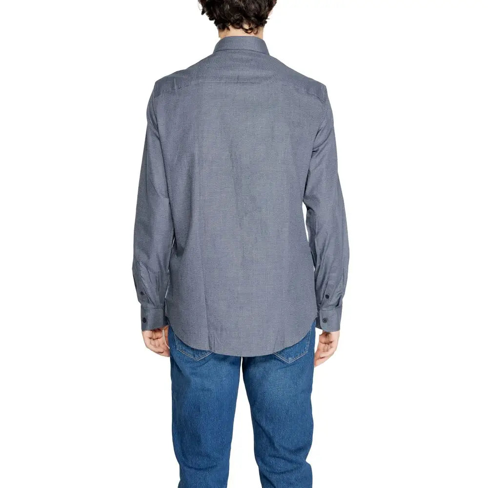 Chemise habillée armani exchange bleu en coton avec texture subtile manches longues col classique et poignets boutonnés