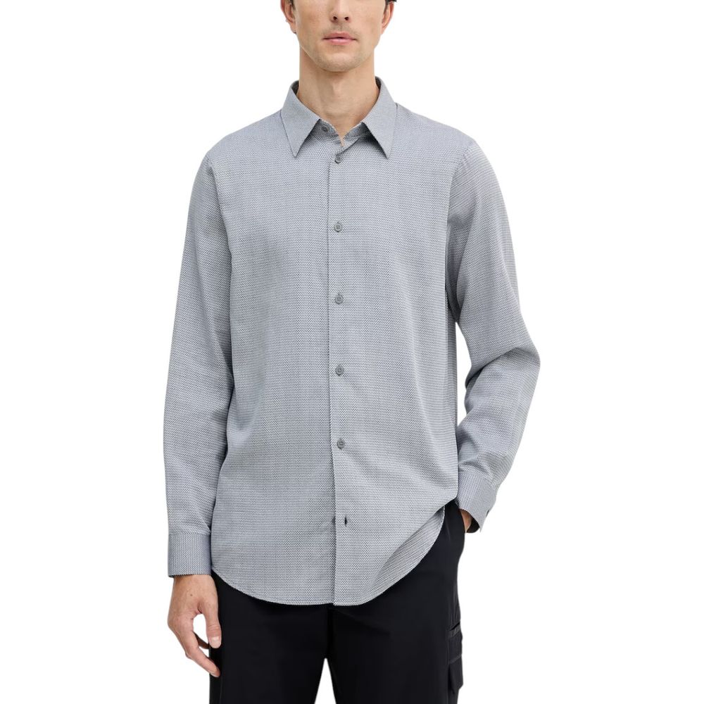 Chemise homme Armani Exchange en coton noir et blanc avec col classique et manches longues, style élégant et moderne.