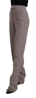 Pantalon long en soie marron à taille haute de coupe tapered, de la marque Armani, visible en détail dans l'image.