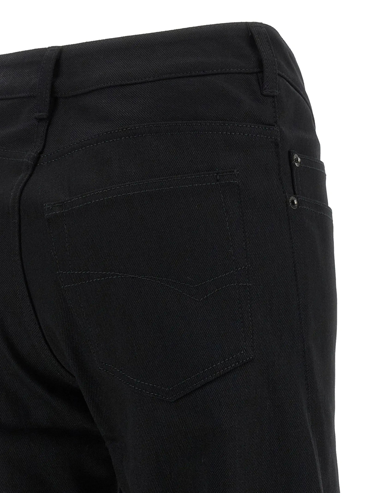 Vue arrière des jeans balenciaga noirs en coton flare avec poches arrière classiques et coutures discrètes